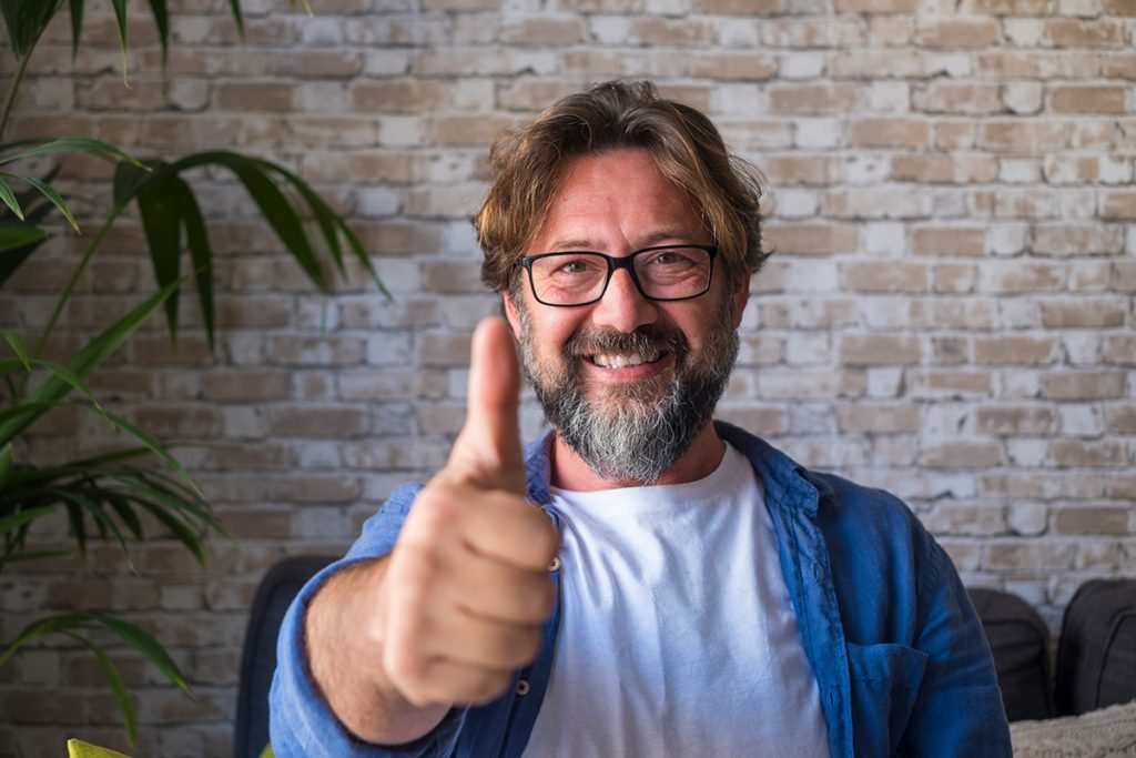 portrait of a cheerful man wearing glasses